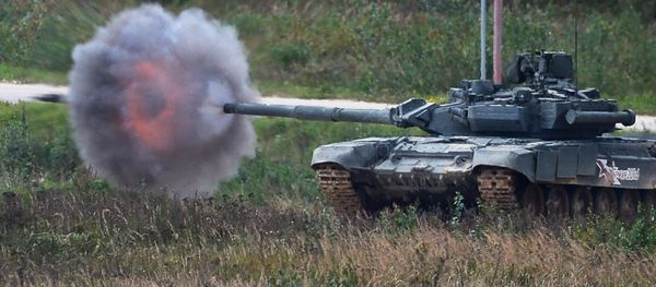 A T-90 tank shoots during a demo exercise at Alabino base (File) A T-90 tank shoots during a demo exercise at Alabino base (File) - Sputnik International