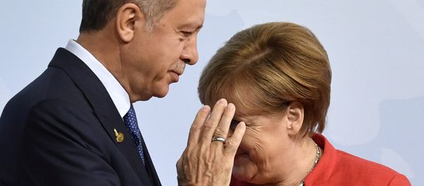 German Chancellor Angela Merkel, right, greets Turkey's President Recep Tayyip Erdogan at the beginning of the G-20 meeting in Hamburg, northern Germany, on Friday, July 7, 2017 German Chancellor Angela Merkel, right, greets Turkey's President Recep Tayyip Erdogan at the beginning of the G-20 meeting in Hamburg, northern Germany, on Friday, July 7, 2017 - Sputnik International