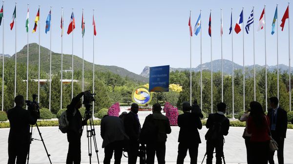 Journalist take pictures outside the venue of a summit at the Belt and Road Forum in Beijing, Monday, May 15, 2017 - Sputnik International