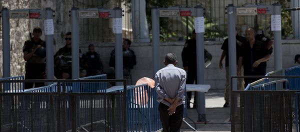 A Palestinian man walks towards a metal detector at the Al Aqsa Mosque compound in Jerusalem's Old City, Wednesday, July 19, 2017 A Palestinian man walks towards a metal detector at the Al Aqsa Mosque compound in Jerusalem's Old City, Wednesday, July 19, 2017 - Sputnik International