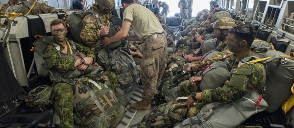 Paratroopers prepare for deployment onboard a US aircraft during the Swift Response 2017 international military exercise at Papa Airbase near Papa, 146 kms southwest of Budapest, Hungary, Tuesday, July 18, 2017. Swift Response is part of the Saber Guardian 2017 (SG17) multinational military exercise held annually in the Black Sea Region as part of the U.S. European Command Joint Exercise Program. The lead organizations for Saber Guardian 2017 are U.S. Army Europe and the Bulgarian Armed Forces. SG17 is co-hosted by the Bulgarian, Hungarian and Romanian land force components and it takes place in numerous locations across Bulgaria, Hungary and Romania in the summer of 2017 - Sputnik International