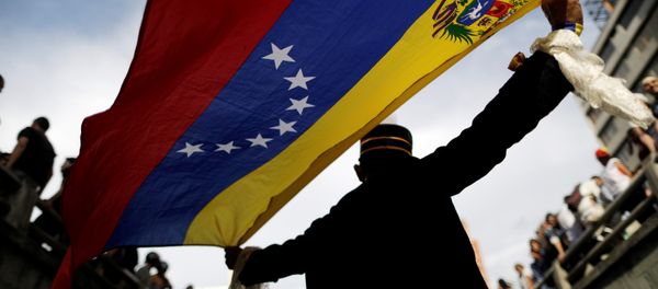 Opposition supporters attend a rally to pay tribute to victims of violence during protests against Venezuelan President Nicolas Maduro's government in Caracas, Venezuela, July 24, 2017. - Sputnik International