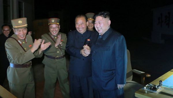 North Korean leader Kim Jong Un guides the second test-fire of intercontinental ballistic missile (ICBM) Hwasong-14 in this undated picture provided by KCNA in Pyongyang on July 29, 2017. - Sputnik International