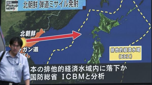  A man walks in front of a public TV screen broadcasting news of North Korea's test-firing of its second intercontinental ballistic missile, in Tokyo Saturday, July 29, 2017. - Sputnik International
