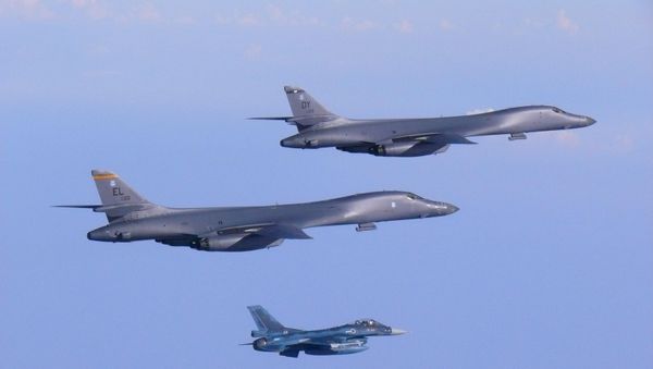 Two U.S. Air Force B-1B Lancer bombers fly a 10-hour mission from Andersen Air Force Base, Guam, escorted by a Japan Air Self-Defense Force F-2 fighter jet into Japanese airspace and then over the Korean Peninsula, July 30, 2017 - Sputnik International