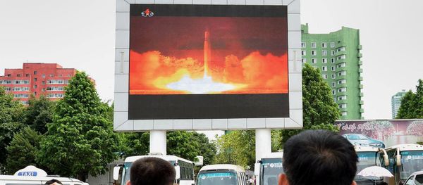 People watch news report showing North Korea's Hwasong-14 missile launch on electronic screen at Pyongyang station, North Korea in this photo taken by Kyodo on July 29, 2017 People watch news report showing North Korea's Hwasong-14 missile launch on electronic screen at Pyongyang station, North Korea in this photo taken by Kyodo on July 29, 2017 - Sputnik International