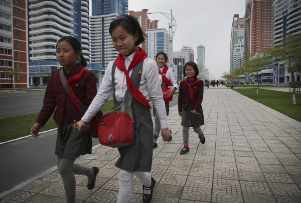 North Korean school girls hold back their laughter at seeing their photograph being taken while walking along Mirae Scientists Street on Wednesday, April 19, 2017, in Pyongyang, North Korea North Korean school girls hold back their laughter at seeing their photograph being taken while walking along Mirae Scientists Street on Wednesday, April 19, 2017, in Pyongyang, North Korea - Sputnik International