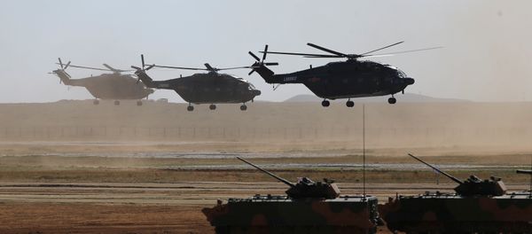Helicopters and armoured vehicles participate in the military parade to commemorate the 90th anniversary of the foundation of the China's People's Liberation Army (PLA) at Zhurihe military training base in Inner Mongolia Autonomous Region, China, July 30, 2017 - Sputnik International