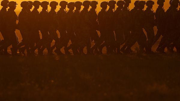 In this photo released by China's Xinhua News Agency, Chinese People's Liberation Army (PLA) troops march in formation Sunday, July 30, 2017, as they arrive for a military parade to commemorate the 90th anniversary of the founding of the PLA on Aug - Sputnik International