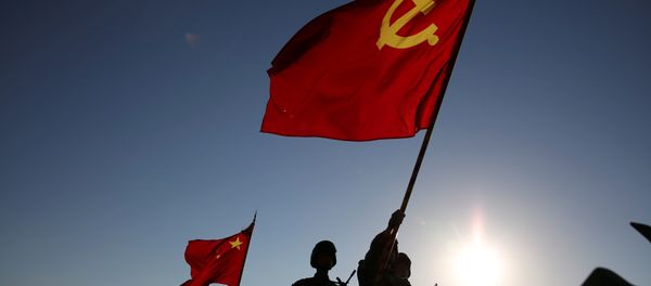 Soldiers carry a PLA flag and Chinese national flags before the military parade to commemorate the 90th anniversary of the foundation of China's People's Liberation Army (PLA) at Zhurihe military base in Inner Mongolia Autonomous Region, China, July 30, 2017 - Sputnik International