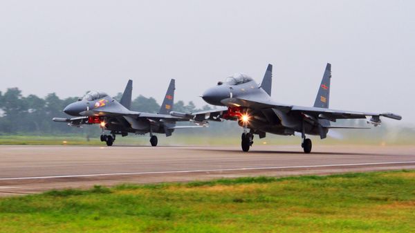 In this undated file photo released Saturday, Aug. 6, 2016, by China's Xinhua News Agency, two Chinese SU-30 fighter jets take off from an unspecified location to fly a patrol over the South China Sea In this undated file photo released Saturday, Aug. 6, 2016, by China's Xinhua News Agency, two Chinese SU-30 fighter jets take off from an unspecified location to fly a patrol over the South China Sea - Sputnik International