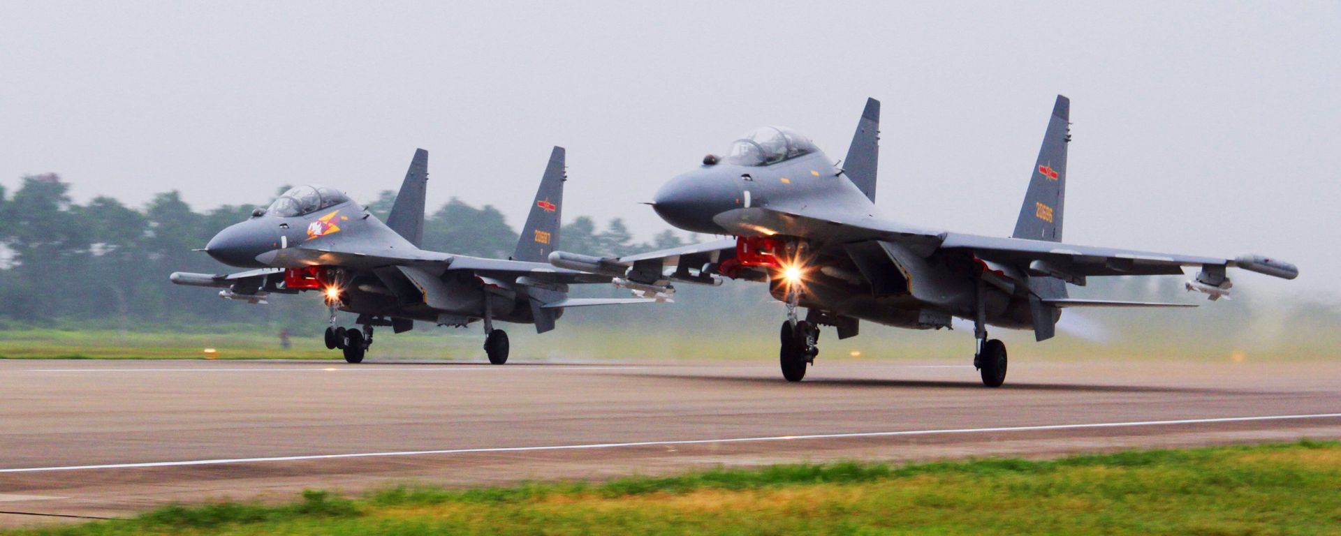 In this undated file photo released Saturday, Aug. 6, 2016, by China's Xinhua News Agency, two Chinese SU-30 fighter jets take off from an unspecified location to fly a patrol over the South China Sea In this undated file photo released Saturday, Aug. 6, 2016, by China's Xinhua News Agency, two Chinese SU-30 fighter jets take off from an unspecified location to fly a patrol over the South China Sea - Sputnik International, 1920, 03.10.2021