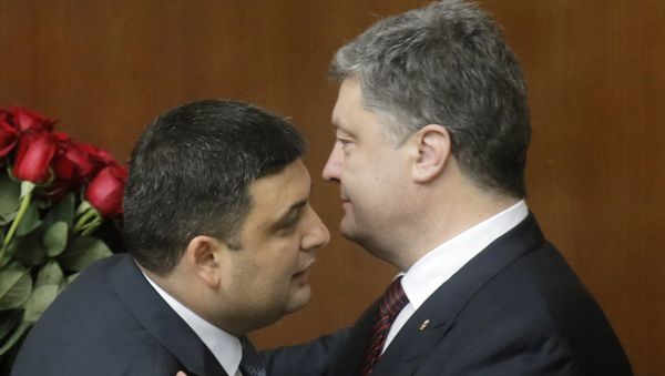 Ukraine's President Petro Poroshenko, right, and Prime Minister Volodymyr Groysman celebrate after Groysman was appointed the Prime Minister during the Ukrainian parliament session in Kiev, Ukraine, Thursday, April 14, 2016 - Sputnik International