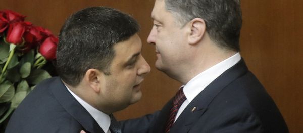 Ukraine's President Petro Poroshenko, right, and Prime Minister Volodymyr Groysman celebrate after Groysman was appointed the Prime Minister during the Ukrainian parliament session in Kiev, Ukraine, Thursday, April 14, 2016 Ukraine's President Petro Poroshenko, right, and Prime Minister Volodymyr Groysman celebrate after Groysman was appointed the Prime Minister during the Ukrainian parliament session in Kiev, Ukraine, Thursday, April 14, 2016 - Sputnik International