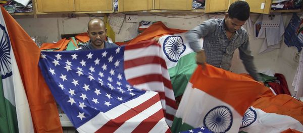 Indian men fold the U.S. and Indian flags at a shop in Mumbai, India (File) Indian men fold the U.S. and Indian flags at a shop in Mumbai, India (File) - Sputnik International