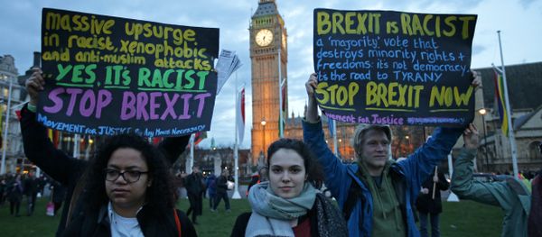 Protesters hold up anti-Brexit placards as they take part in a protest in support of an amendment to guarantee legal status of EU citizens, outside the Houses of Parliament in London on March 13, 2017 Protesters hold up anti-Brexit placards as they take part in a protest in support of an amendment to guarantee legal status of EU citizens, outside the Houses of Parliament in London on March 13, 2017 - Sputnik International