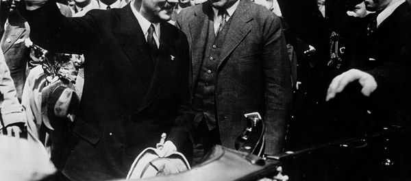 Adolf Hitler, left, Nazi chancellor of Germany, and Konstantin von Neurath, German Minister of Foreign Affairs, (right center) as they returned to Munich, Germany, from their meeting with Premier Benito Mussolini of Italy, June 25, 1934. - Sputnik International