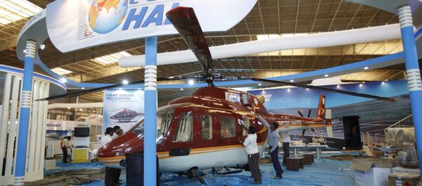 Workers polish a helicopter at the stall of Hindustan Aeronautics Ltd. on the eve of Aero India 2011 at Yelahanka air base on the outskirts of Bangalore, India. (File) Workers polish a helicopter at the stall of Hindustan Aeronautics Ltd. on the eve of Aero India 2011 at Yelahanka air base on the outskirts of Bangalore, India. (File) - Sputnik International