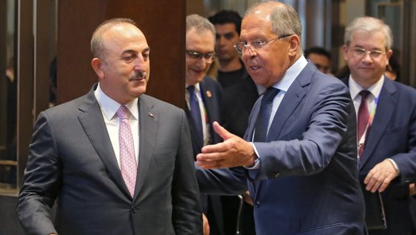 From right: Russian Foreign Minister Sergei Lavrov meets Turkish Foreign Minister Mevlut Cavusoglu. - Sputnik International