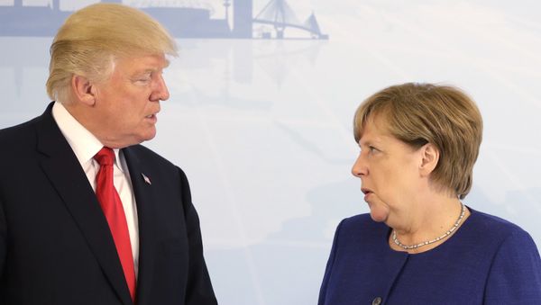 U.S. President Donald Trump, left, and German Chancellor Angela Merkel pose for a photograph prior to a bilateral meeting on the eve of the G-20 summit in Hamburg, northern Germany, Thursday, July 6, 2017 U.S. President Donald Trump, left, and German Chancellor Angela Merkel pose for a photograph prior to a bilateral meeting on the eve of the G-20 summit in Hamburg, northern Germany, Thursday, July 6, 2017 - Sputnik International