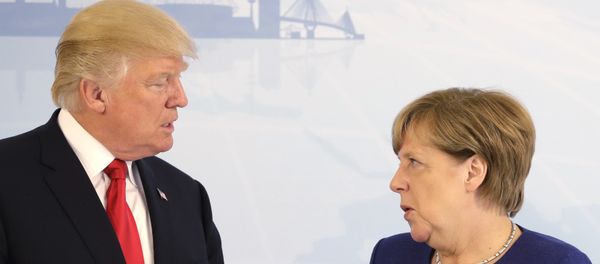 U.S. President Donald Trump, left, and German Chancellor Angela Merkel pose for a photograph prior to a bilateral meeting on the eve of the G-20 summit in Hamburg, northern Germany, Thursday, July 6, 2017 - Sputnik International
