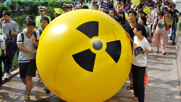 South Korean activists march while rolling a large balloon with a radioactivity warning sign during an anti-nuclear protest in Seoul on August 6, 2013 on the 68th anniversary of the atomic bombing of Hiroshima in Japan South Korean activists march while rolling a large balloon with a radioactivity warning sign during an anti-nuclear protest in Seoul on August 6, 2013 on the 68th anniversary of the atomic bombing of Hiroshima in Japan - Sputnik International