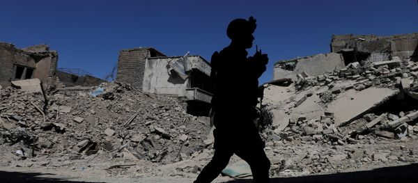 A member of Iraqi federal police patrols in the destroyed Old City of Mosul, Iraq August 7, 2017 A member of Iraqi federal police patrols in the destroyed Old City of Mosul, Iraq August 7, 2017 - Sputnik International