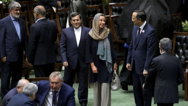 European Union foreign policy chief Federica Mogherini, center, attends the swearing-in ceremony of President Hasan Rouhani for the second term in office, at the parliament in Tehran, Iran, Saturday, Aug. 5, 2017 European Union foreign policy chief Federica Mogherini, center, attends the swearing-in ceremony of President Hasan Rouhani for the second term in office, at the parliament in Tehran, Iran, Saturday, Aug. 5, 2017 - Sputnik International
