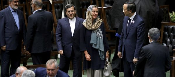 European Union foreign policy chief Federica Mogherini, center, attends the swearing-in ceremony of President Hasan Rouhani for the second term in office, at the parliament in Tehran, Iran, Saturday, Aug. 5, 2017 European Union foreign policy chief Federica Mogherini, center, attends the swearing-in ceremony of President Hasan Rouhani for the second term in office, at the parliament in Tehran, Iran, Saturday, Aug. 5, 2017 - Sputnik International