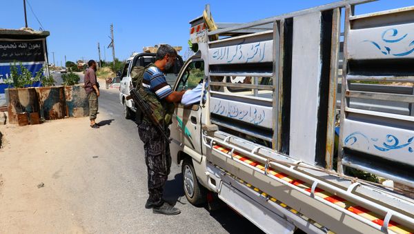 Members from a coalition of rebel groups called Jaish al Fateh, also known as Army of Fatah (Conquest Army), man a checkpoint in Idlib city, Syria July 18, 2017. Picture taken July 18, 2017 Members from a coalition of rebel groups called Jaish al Fateh, also known as Army of Fatah (Conquest Army), man a checkpoint in Idlib city, Syria July 18, 2017. Picture taken July 18, 2017 - Sputnik International