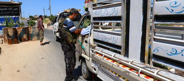 Members from a coalition of rebel groups called Jaish al Fateh, also known as Army of Fatah (Conquest Army), man a checkpoint in Idlib city, Syria July 18, 2017. Picture taken July 18, 2017 Members from a coalition of rebel groups called Jaish al Fateh, also known as Army of Fatah (Conquest Army), man a checkpoint in Idlib city, Syria July 18, 2017. Picture taken July 18, 2017 - Sputnik International
