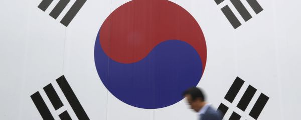 A man walks by a huge national flag printed on the wall in Seoul, South Korea, Wednesday, Oct. 26, 2016 A man walks by a huge national flag printed on the wall in Seoul, South Korea, Wednesday, Oct. 26, 2016 - Sputnik International