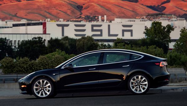 First production model of Tesla Model 3 out the assembly line is seen in this undated handout photo from Tesla Motors. - Sputnik International