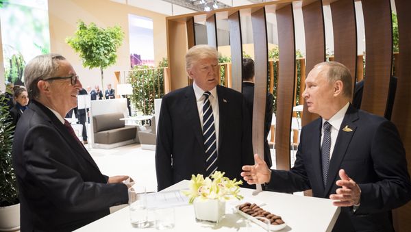 In this photo provided by German government U.S. President Donald Trump, center, talks to Russian President Vladimir Putin and European Commission President Jean-Claude Juncker, left, before the first working session of the G-20 summit in Hamburg, northern Germany. In this photo provided by German government U.S. President Donald Trump, center, talks to Russian President Vladimir Putin and European Commission President Jean-Claude Juncker, left, before the first working session of the G-20 summit in Hamburg, northern Germany. - Sputnik International