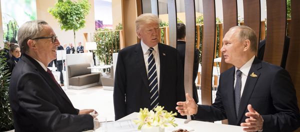 In this photo provided by German government U.S. President Donald Trump, center, talks to Russian President Vladimir Putin and European Commission President Jean-Claude Juncker, left, before the first working session of the G-20 summit in Hamburg, northern Germany. In this photo provided by German government U.S. President Donald Trump, center, talks to Russian President Vladimir Putin and European Commission President Jean-Claude Juncker, left, before the first working session of the G-20 summit in Hamburg, northern Germany. - Sputnik International