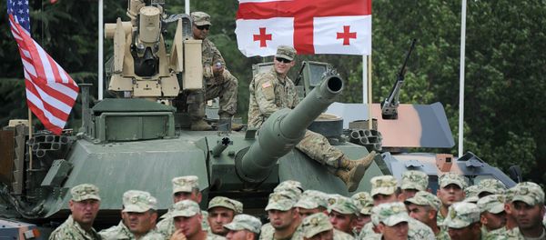 US and Georgian servicemen participating in the joint multinational military exercise 'Noble Partner 2017' wait for the arrival of US Vice President Mike Pence at an airbase outside Tbilisi on August 1, 2017 US and Georgian servicemen participating in the joint multinational military exercise 'Noble Partner 2017' wait for the arrival of US Vice President Mike Pence at an airbase outside Tbilisi on August 1, 2017 - Sputnik International