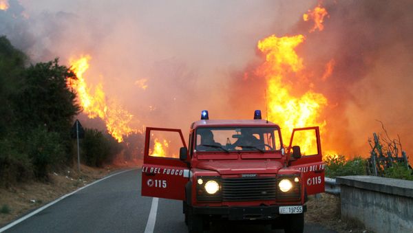 Firemen arrive where wind-whipped fires, that have been ravaging parts of Sicily, reached a hotel near the port city of Messina Wednesday, Aug. 22, 2007, killing three people and leaving another two missing. Firemen arrive where wind-whipped fires, that have been ravaging parts of Sicily, reached a hotel near the port city of Messina Wednesday, Aug. 22, 2007, killing three people and leaving another two missing. - Sputnik International