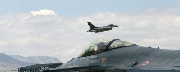 A Turkish F-16 prepares to taxi while another one takes off during Anatolian Eagle exercise at 3rd Main Jet Air Base near the central Anatolian city of Konya, Turkey, Monday, June 15, 2009 - Sputnik International