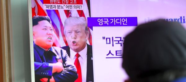 A man watches a television news programme showing US President Donald Trump (C) and North Korean leader Kim Jong-Un (L) at a railway station in Seoul on August 9, 2017 A man watches a television news programme showing US President Donald Trump (C) and North Korean leader Kim Jong-Un (L) at a railway station in Seoul on August 9, 2017 - Sputnik International