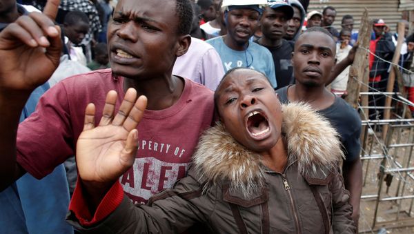 A woman cries after a supporter of opposition leader Raila Odinga was killed by police, witnesses said, in Mathare slum in Nairobi, Kenya August 9, 2017. - Sputnik International