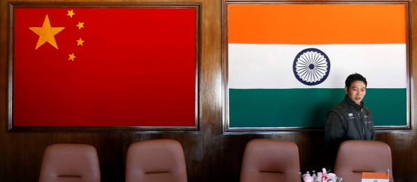 A man walks inside a conference room used for meetings between military commanders of China and India, at the Indian side of the Indo-China border at Bumla, in the northeastern Indian state of Arunachal Pradesh, November 11, 2009 A man walks inside a conference room used for meetings between military commanders of China and India, at the Indian side of the Indo-China border at Bumla, in the northeastern Indian state of Arunachal Pradesh, November 11, 2009 - Sputnik International