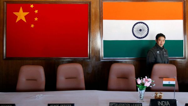A man walks inside a conference room used for meetings between military commanders of China and India, at the Indian side of the Indo-China border at Bumla, in the northeastern Indian state of Arunachal Pradesh, November 11, 2009 A man walks inside a conference room used for meetings between military commanders of China and India, at the Indian side of the Indo-China border at Bumla, in the northeastern Indian state of Arunachal Pradesh, November 11, 2009 - Sputnik International