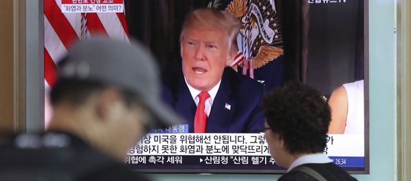 People walk by a TV screen showing a local news program reporting with an image of U.S. President Donald Trump at the Seoul Train Station in Seoul, South Korea, Wednesday, Aug. 9, 2017 People walk by a TV screen showing a local news program reporting with an image of U.S. President Donald Trump at the Seoul Train Station in Seoul, South Korea, Wednesday, Aug. 9, 2017 - Sputnik International