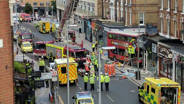 Emergency services attend the scene of a bus crash in Lavender Hill, London August 10, 2017 in this picture obtained on social media Emergency services attend the scene of a bus crash in Lavender Hill, London August 10, 2017 in this picture obtained on social media - Sputnik International