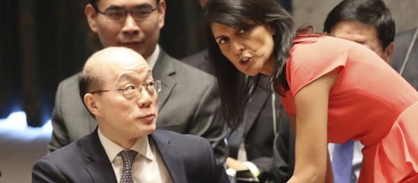 American Ambassador to the United Nations Nikki Haley, right, speaks to Chinese Ambassador to the United Nations Liu Jieyi before a Security Council vote on a new sanctions resolution that would increase economic pressure on North Korea to return to negotiations on its missile program, Saturday, Aug. 5, 2017 at U.N. headquarters - Sputnik International