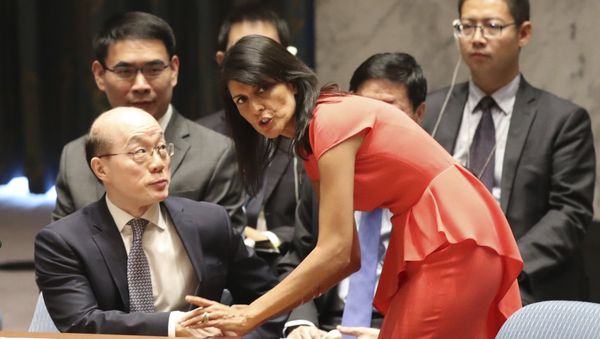 American Ambassador to the United Nations Nikki Haley, right, speaks to Chinese Ambassador to the United Nations Liu Jieyi before a Security Council vote on a new sanctions resolution that would increase economic pressure on North Korea to return to negotiations on its missile program, Saturday, Aug. 5, 2017 at U.N. headquarters - Sputnik International
