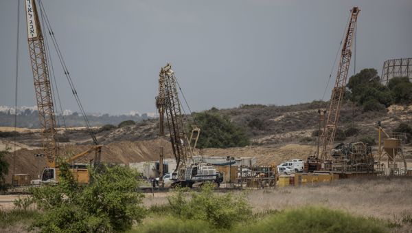 In this Thursday, Sept. 8, 2016 file photo, heavy machinery works on a massive underground barrier on the Israeli side of the border with Gaza In this Thursday, Sept. 8, 2016 file photo, heavy machinery works on a massive underground barrier on the Israeli side of the border with Gaza - Sputnik International