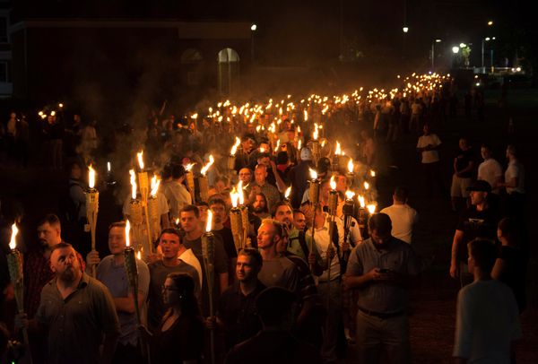 White nationalists carry torches on the grounds of the University of Virginia, on the eve of a planned Unite The Right rally in Charlottesville, Virginia, U.S - Sputnik International