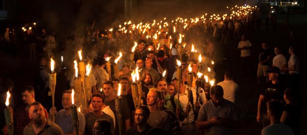 White nationalists carry torches on the grounds of the University of Virginia, on the eve of a planned Unite The Right rally in Charlottesville, Virginia, U.S White nationalists carry torches on the grounds of the University of Virginia, on the eve of a planned Unite The Right rally in Charlottesville, Virginia, U.S - Sputnik International