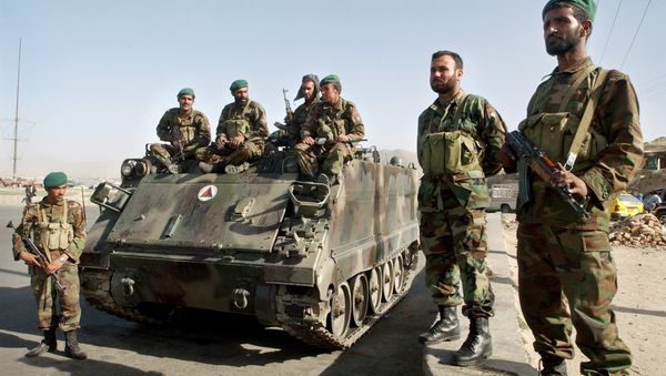 Afghan National Army soldiers stand near an armored military tank at a square in Kabul, Afghanistan on Tuesday, May 30, 2006. - Sputnik International